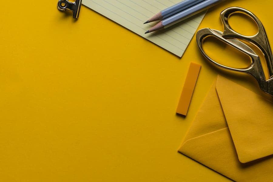 Scissors, envelopes and pencils on a desk