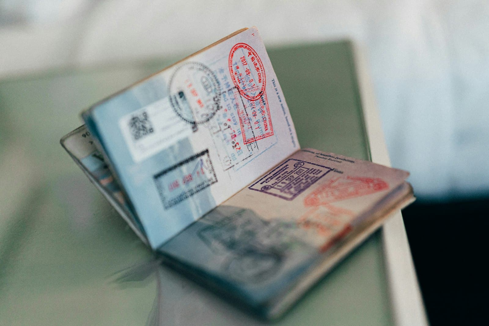 Open passport with entry stamps